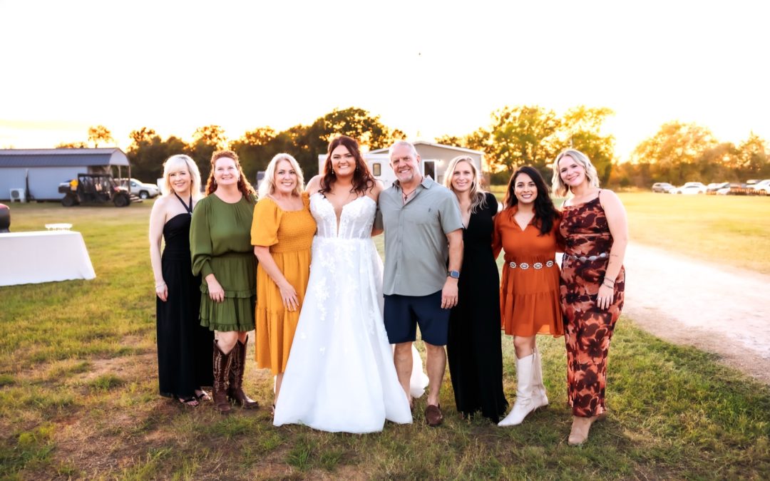 Mikayla on her wedding day with Dr. Jeff Lynch and members of the McKinneyDentist.com Esteem team